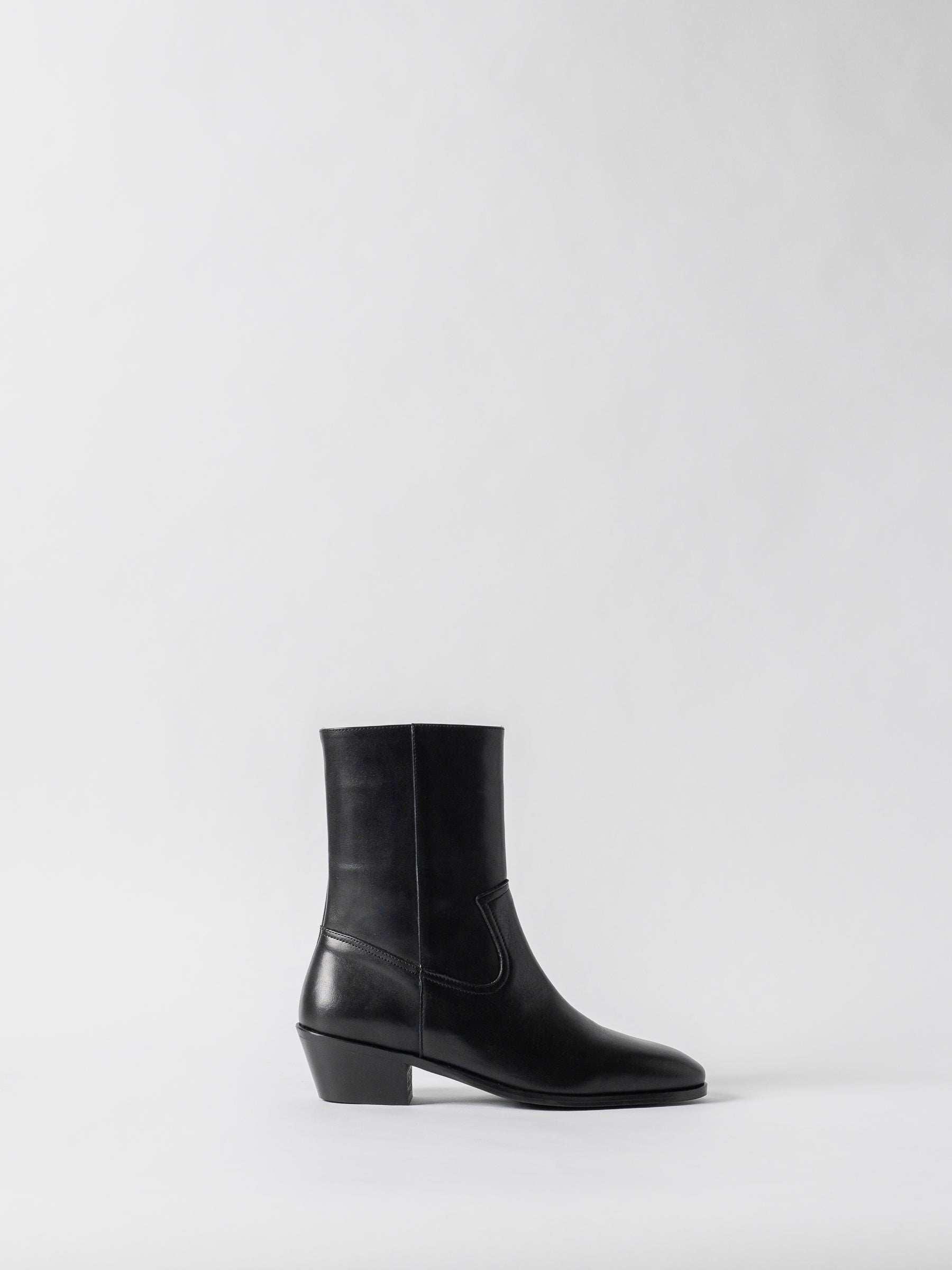 Black ankle boot on a white background